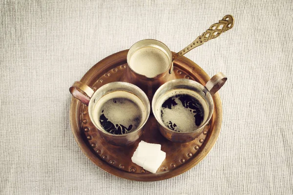 Turkish,Arabic coffee for two in copper set and sugar cubes.