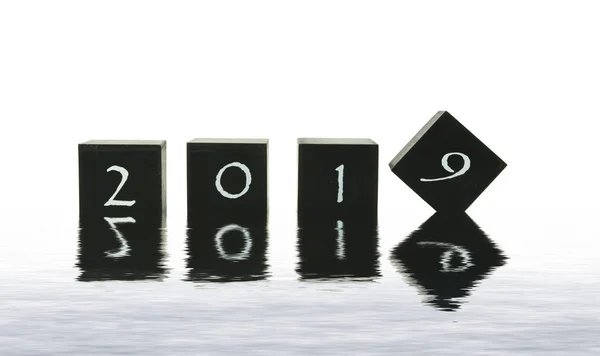 Black blocks with 2018 changing in 2019 — Stock Photo, Image