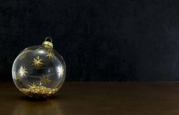 Transparent christmas ball on dark background — Stock Photo, Image