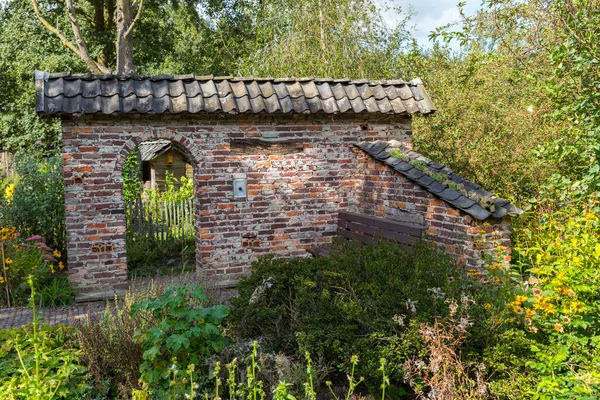 ruin of an old stone shed with an arch as entrance