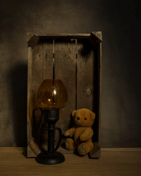 Still life with teddy and old light — Stock Photo, Image
