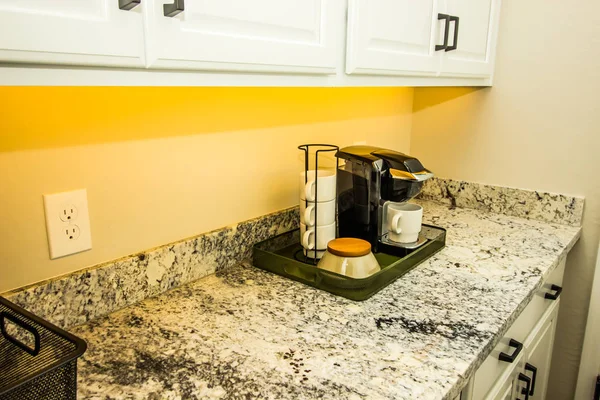 Coffee Maker And Mugs On Portable Tray On Kitchen Granite Counte