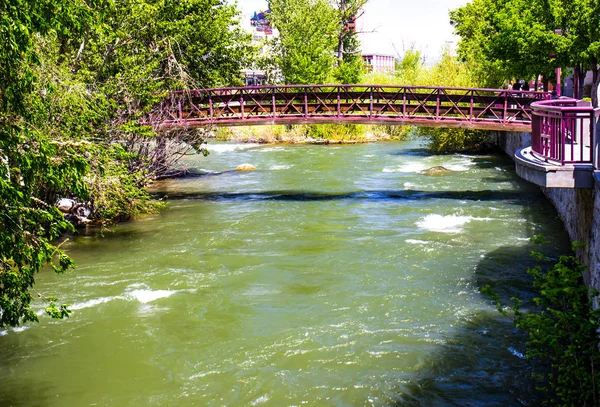 Walking Bridge Over Rushing River