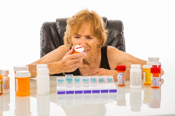 Senior Woman Not Understanding Pills She Takes From Her Weekly P