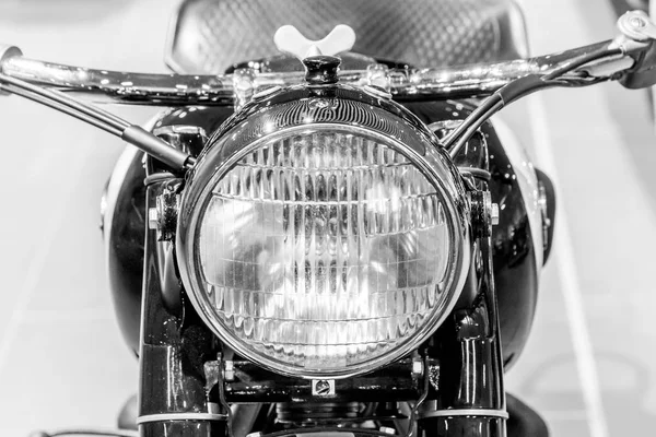 old motorcycle close-up, front light and motorcycle handlebar
