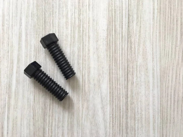 Tornillos Plástico Negro Fondo Madera —  Fotos de Stock