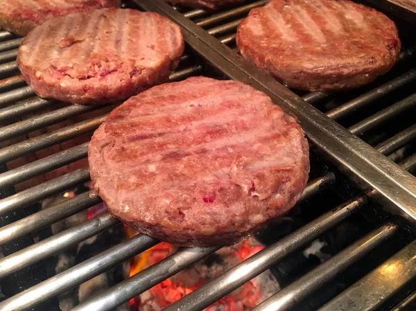 Preparing some burgers on the metal grill