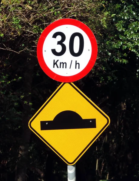 Bump and 30 kmh speed limit traffic signs