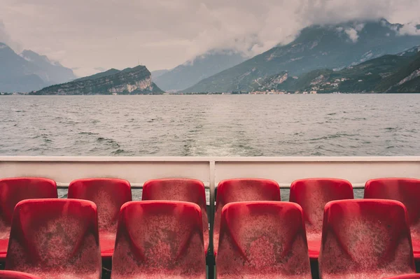 View to Torbole rocks from an upper deck of a public ferry