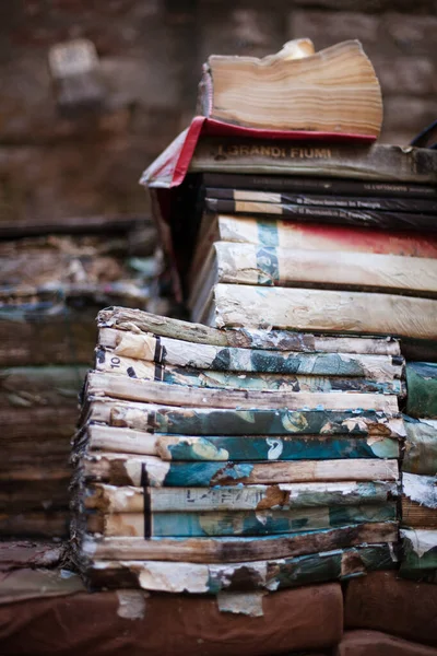 Piles of old books and journals ready for recycling