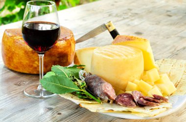 Sardinian salami, pecorino cheese and wine selection clipart