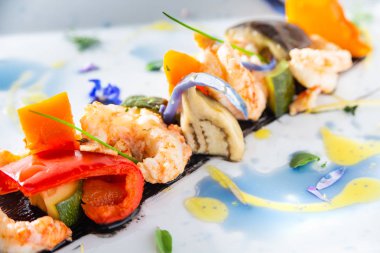grilled seafood  on white plate