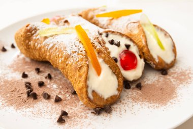 Cannoli Siciliani, typical italian dessert with ricotta and candied fruit