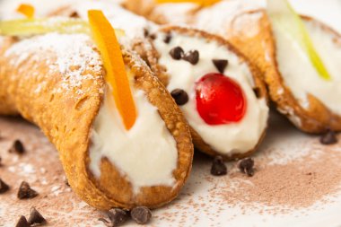 Cannoli Siciliani, typical italian dessert with ricotta and candied fruit