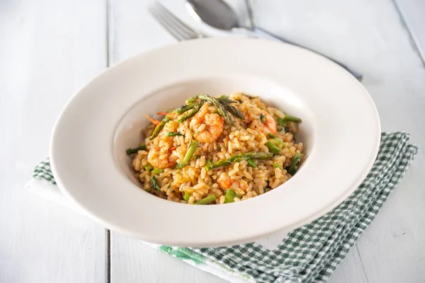 Dish of risotto with shrimps and asparagus