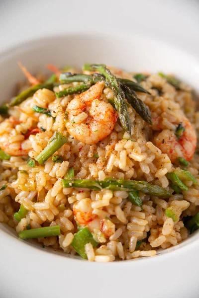 Dish of risotto with shrimps and asparagus