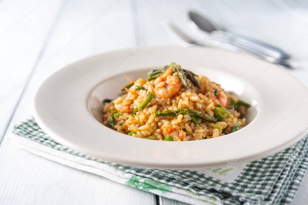 Dish of risotto with shrimps and asparagus