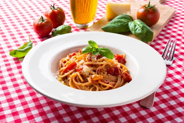 Dish of delicios spaghetti with tomato sauce and cheese
