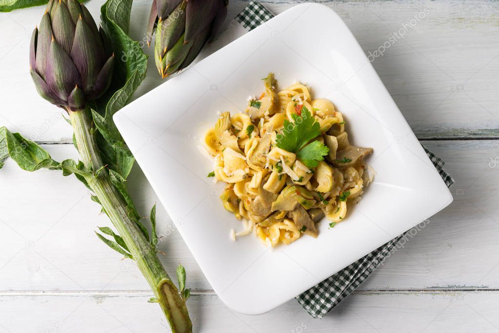 Dish of orecchiette pasta with artichokes, Italian Cuisine