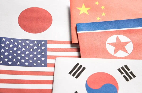 The flag of North Korea, South Korea, United Stated of America (USA), Japan and China made from paper.