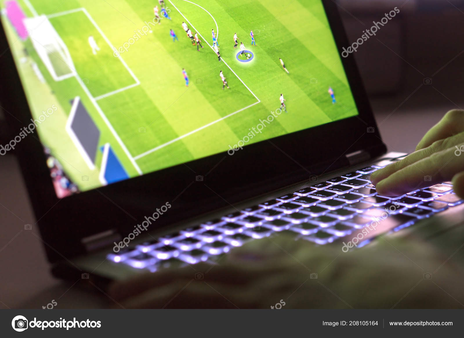 Young Man Playing Video Game Laptop Online Soccer Football Game Stock Photo by ©terovesalainen 208105164