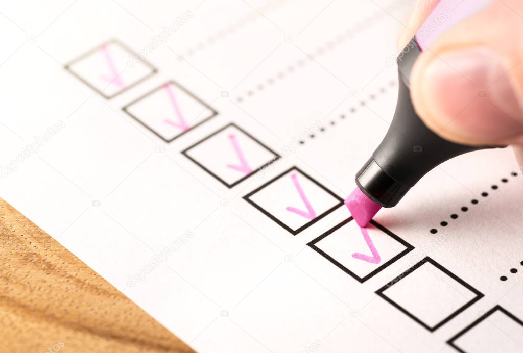 Checklist, keeping score of obligations or completed tasks in project concept. Check list document of finished work duties,  progress or agenda. Business man writing tick mark in checkbox with marker.