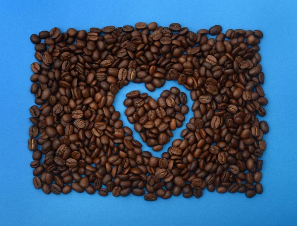 Grãos Café Forma Coração Fundo Azul Coração Forma Grãos Café — Fotografia de Stock