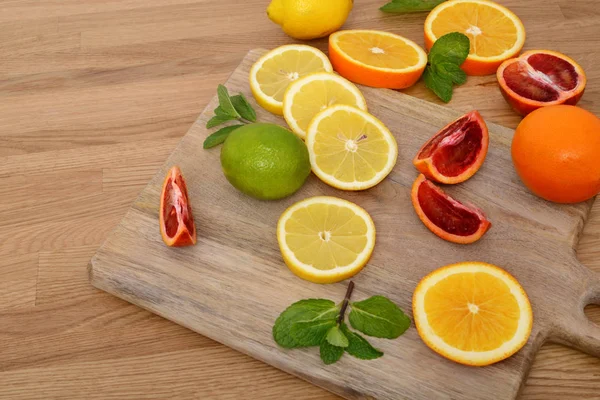 Mix citrus fresh fruit on the wooden table Royalty Free Stock Images