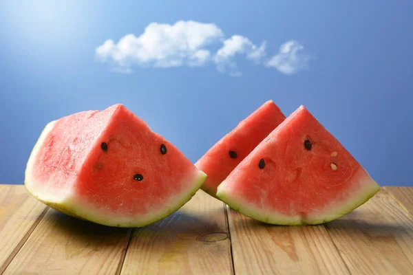 Slices Red Watermelon Wooden Table Blue Sky Background Closeup — Stock Photo, Image