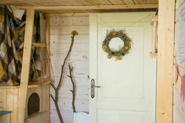 White front door with New Year\'s wreath