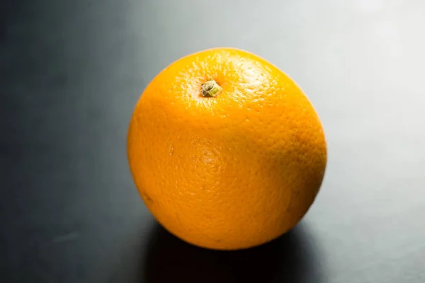 Fresh orange on black background