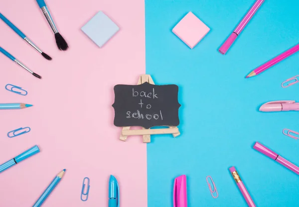School supplies and a blackboard with Back to School — Stock Photo, Image