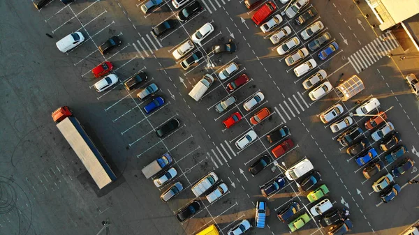 City parking lot with cars and big truck. Aerial. View above.