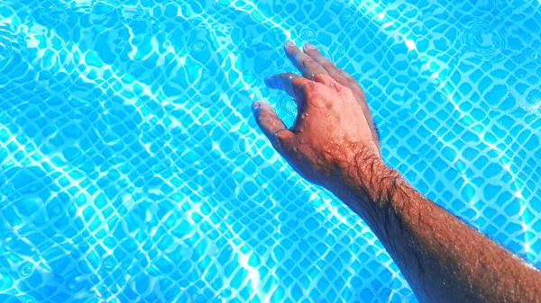 Male Tanned Hand Pool Blue Water Relax Spa Recreation Concept — Stock Photo, Image