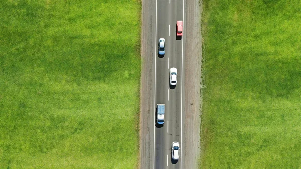 Rural highway with cars. Top view. Aerial.