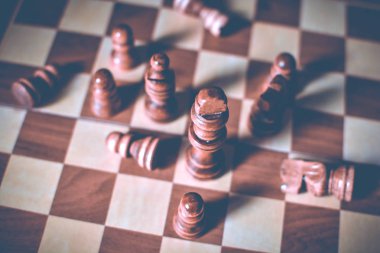 Business strategy concept with chess board and figures