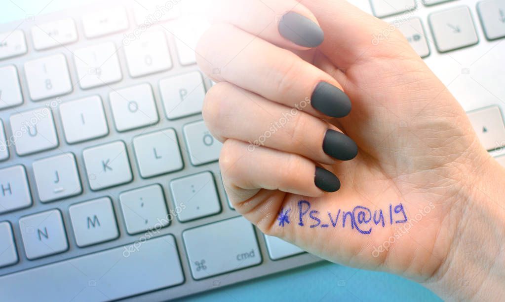 Keep passwords safe concept with written password symbols on a palm.