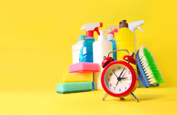 Cleaning Service Background Household Chemicals Red Alarm Clock Saving Time — ストック写真