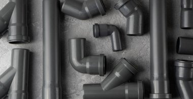 Boru tesisatı arka planı. Beton zemindeki kanalizasyon boruları. Kırpılmış.