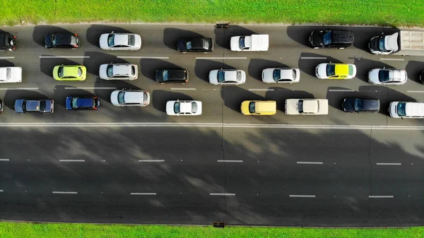 Aerial. Traffic jam with cars on a highway. Peak hour. Top view from drone.