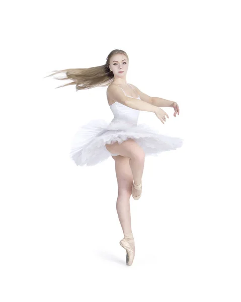 Uma menina com cabelos longos, em um balé branco tutu dança . — Fotografia de Stock