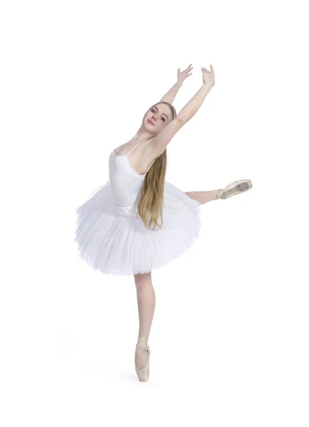 A girl with long hair, in a white tutu dancing ballet. — Stock Photo, Image