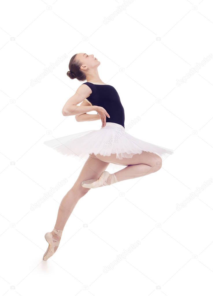 Gorgeous ballerina, in a white tutu dancing ballet.