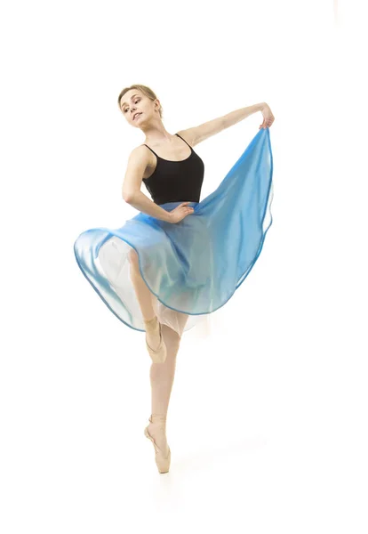 Girl in a blue skirt and a black leotard dance ballet. — Stock Photo, Image