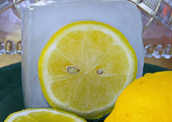 Fresh lemon cut in ice cube close-up of citrus for lemonade
