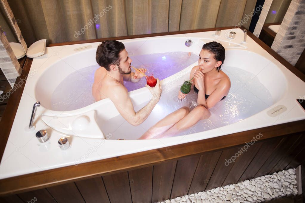 top view portrait of young woman and man taking bath together