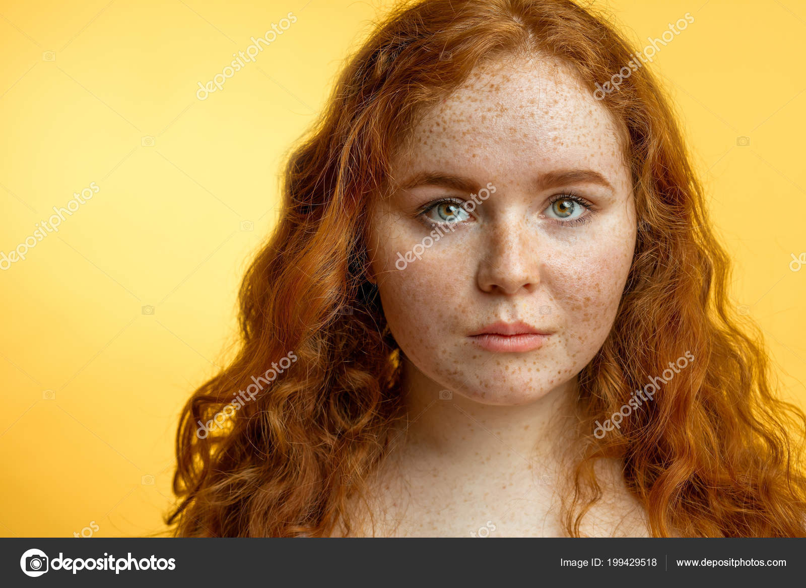 Close Up Of Beautiful Red Haired Freckled Girl With Loose Curly