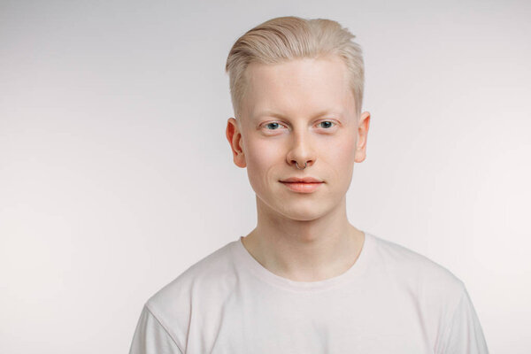 Handsome blond man with blue eyes isolated on white