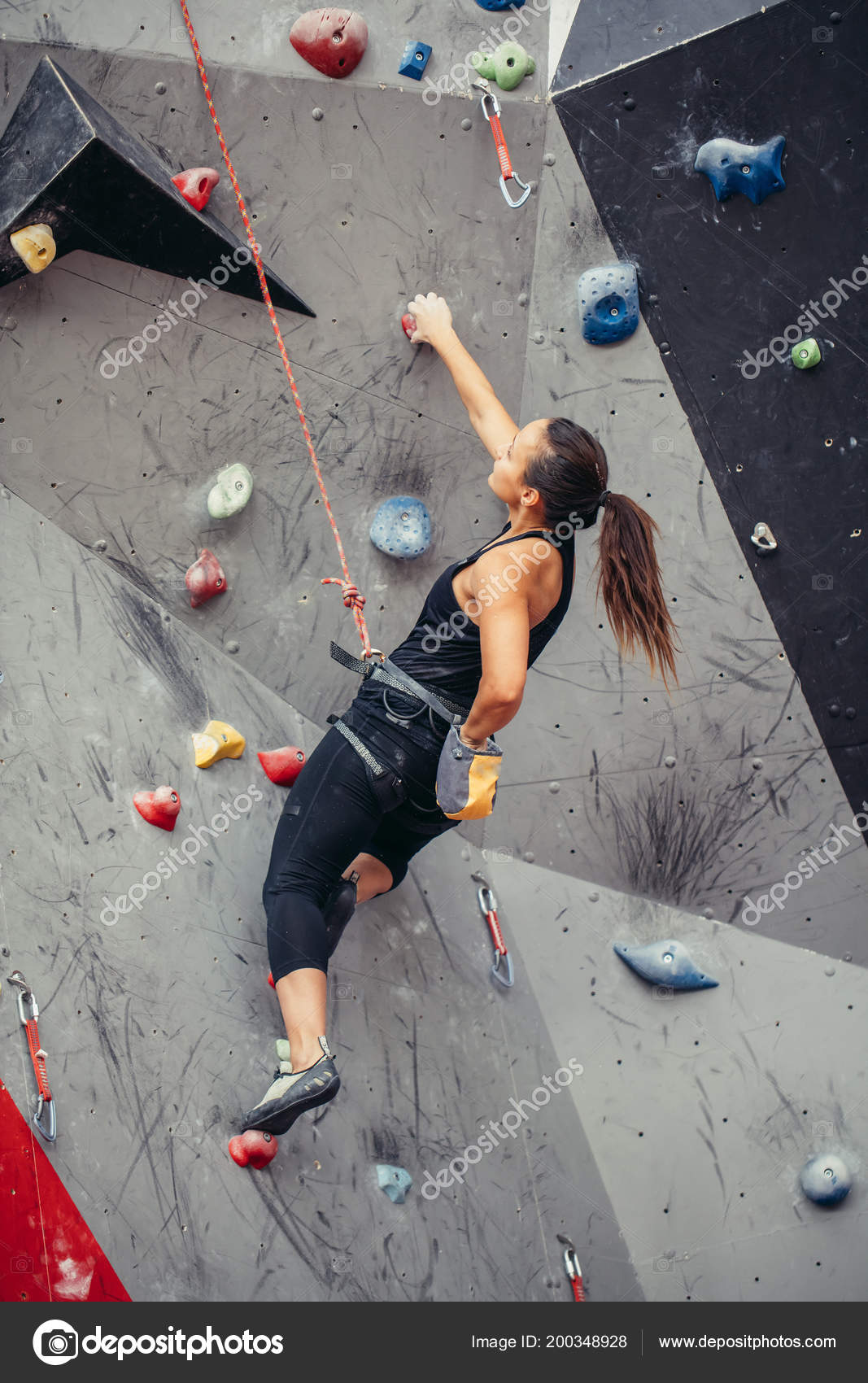 Sporty woman in boulder climbing hall Stock Photo by ©ufabizphoto 200348928