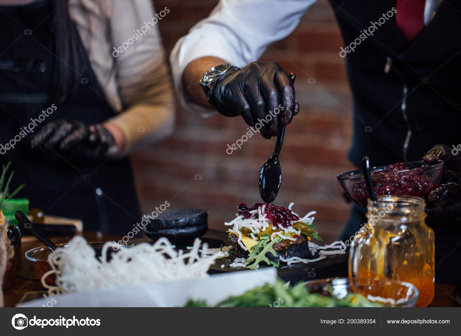 Chef making beef burgers at burger pub Stock Photo by
